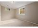 Carpeted bedroom featuring a window that brings in natural light at 8231 E Lehigh Dr, Denver, CO 80237