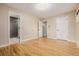 Spacious bedroom featuring hardwood floors and ensuite bathroom with modern shower at 8231 E Lehigh Dr, Denver, CO 80237