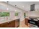 A well-appointed kitchen offers modern appliances and ample countertop space at 8231 E Lehigh Dr, Denver, CO 80237
