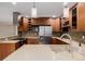 This kitchen features wood cabinets, stainless steel appliances, and sleek countertops at 8231 E Lehigh Dr, Denver, CO 80237
