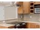 A well-appointed kitchen offers modern appliances and ample countertop space at 8231 E Lehigh Dr, Denver, CO 80237