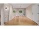 Bright living room with hardwood floors and natural light, open to other living spaces at 8231 E Lehigh Dr, Denver, CO 80237