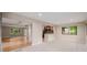 Open living space featuring hardwood floors, modern kitchen, and bright windows at 8231 E Lehigh Dr, Denver, CO 80237