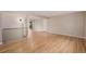 Stylish room with modern lighting, hardwood floors, and a large window at 8231 E Lehigh Dr, Denver, CO 80237