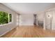 Spacious room with hardwood floors, featuring large window at 8231 E Lehigh Dr, Denver, CO 80237
