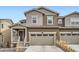 Charming two-story home boasts a two-car garage and welcoming front porch with fresh, neutral paint at 9012 Borrowdale Ln, Parker, CO 80134