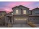 Charming two-story home boasts a two-car garage and welcoming front porch with fresh, neutral paint at 9012 Borrowdale Ln, Parker, CO 80134