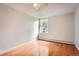 Bright bedroom with hardwood floors, neutral walls, and a large window, creating a comfortable and relaxing environment at 2231 S Vaughn Way # 205B, Aurora, CO 80014