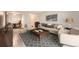 Inviting living room featuring a neutral color palette, stylish furnishings, and an open layout to the dining area at 2231 S Vaughn Way # 205B, Aurora, CO 80014