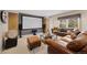 Finished basement featuring home theater, seating and walkout access at 10 Sand Cherry, Littleton, CO 80127