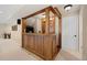 Finished basement featuring custom wooden bar and seating area at 10 Sand Cherry, Littleton, CO 80127