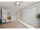 Bedroom featuring vaulted ceiling, closet, and access to bathroom and hallway at 10 Sand Cherry, Littleton, CO 80127