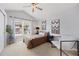 Bright bedroom with vaulted ceiling, large window, and modern decor at 10 Sand Cherry, Littleton, CO 80127
