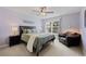 Cozy bedroom with ample natural light, a ceiling fan, and a comfortable armchair at 10 Sand Cherry, Littleton, CO 80127