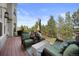 Spacious outdoor deck with comfortable seating and a gas grill at 10 Sand Cherry, Littleton, CO 80127