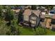 Back of house showing deck with stairs, large well-maintained backyard and privacy fence at 10 Sand Cherry, Littleton, CO 80127