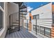 Balcony with a spiral staircase and views of the surrounding neighborhood at 1840 Irving St, Denver, CO 80204