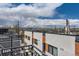 View of the building's exterior with modern design elements and a scenic background at 1840 Irving St, Denver, CO 80204