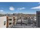 Rooftop view showcasing the city skyline under a beautiful blue sky at 1840 Irving St, Denver, CO 80204