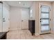 Bright entryway with tiled flooring, ample natural light, and convenient storage solutions at 1840 Irving St, Denver, CO 80204