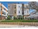 Modern townhouse with a well-manicured lawn and contemporary architectural design at 1840 Irving St, Denver, CO 80204