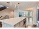 Kitchen island with stainless steel oven, light wood cabinetry, and modern pendant lighting at 1840 Irving St, Denver, CO 80204