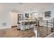 Bright kitchen featuring stainless steel appliances, a center island with bar seating, and modern light fixtures at 1840 Irving St, Denver, CO 80204
