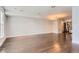 Open living room with hardwood floors and views into the kitchen at 1840 Irving St, Denver, CO 80204