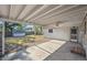 Covered patio with ceiling fan, concrete floor, and view of a shed in a fenced backyard at 5240 Dudley St, Arvada, CO 80002