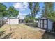 Fenced backyard featuring a storage shed, grassy area, and a pathway with plenty of space at 5240 Dudley St, Arvada, CO 80002