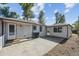 Backyard features a concrete patio area, white siding, and a separate building at 5240 Dudley St, Arvada, CO 80002