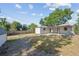 Expansive backyard featuring a storage shed and plenty of room for activities at 5240 Dudley St, Arvada, CO 80002
