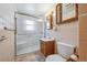 Small bathroom with shower, vanity, and toilet at 5240 Dudley St, Arvada, CO 80002