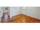 Bright bedroom offering beautiful hardwood floors and featuring a door and doorway to other rooms at 5240 Dudley St, Arvada, CO 80002