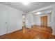 An empty bedroom with hardwood floors and closet, ready for customization and offering versatile space at 5240 Dudley St, Arvada, CO 80002