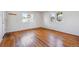 An empty bedroom featuring gleaming hardwood floors and plenty of natural light at 5240 Dudley St, Arvada, CO 80002