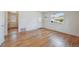 Entry way featuring gleaming hardwood floors and an open concept to the kitchen at 5240 Dudley St, Arvada, CO 80002