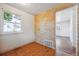 Small nook with floral wallpaper, vinyl flooring, and natural light from the window at 5240 Dudley St, Arvada, CO 80002