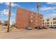 Exterior of a well-kept apartment complex with ample parking at 1833 N Williams St # 101, Denver, CO 80218