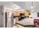 Efficient kitchen with stainless steel appliances, granite countertops, and ample cabinet space, ideal for cooking at 1833 N Williams St # 101, Denver, CO 80218