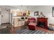 Cozy living room featuring a fireplace, plush seating, and a stylish striped rug, perfect for relaxation at 1833 N Williams St # 101, Denver, CO 80218