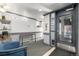 Inviting lobby area with neutral carpet, a stainless steel console table, and a comfortable blue armchair at 1833 N Williams St # 101, Denver, CO 80218
