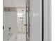 Bathroom doorway view, featuring a tub and vanity with white countertop at 14046 E Stanford Cir # I04, Aurora, CO 80015