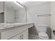 Bright bathroom featuring a vanity with a white countertop and a toilet at 14046 E Stanford Cir # I04, Aurora, CO 80015