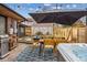 Relaxing backyard with hot tub, patio furniture, and pergola at 3739 E 26Th Avenue Pkwy, Denver, CO 80205