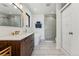 Modern bathroom with a soaking tub, walk-in shower, and stylish vanity at 3739 E 26Th Avenue Pkwy, Denver, CO 80205