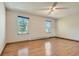 Spacious bedroom with hardwood floors and natural light from two windows at 4351 E 109Th Ave, Thornton, CO 80233