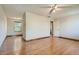 Spacious bedroom featuring hardwood floors with views to another room at 4351 E 109Th Ave, Thornton, CO 80233