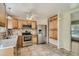 Well-lit kitchen features stainless steel appliances, tile backsplash, and ample cabinet space at 4351 E 109Th Ave, Thornton, CO 80233