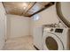 Laundry room with a modern washing machine and tiled floor at 4351 E 109Th Ave, Thornton, CO 80233